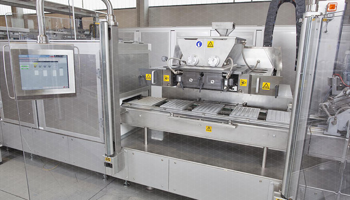 Piston moulding machine for chocolate - MLE-CORE
